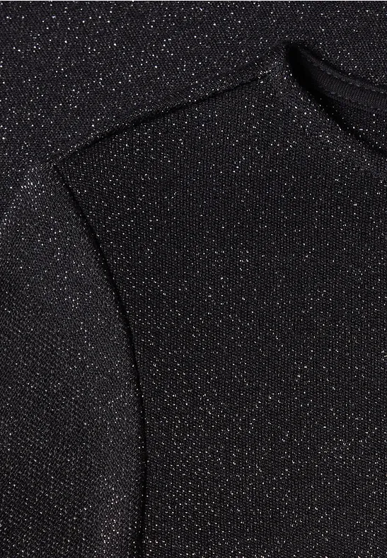 Nahaufnahme eines schwarzen Stoffes mit feinem Glitzereffekt und dezenter Naht.