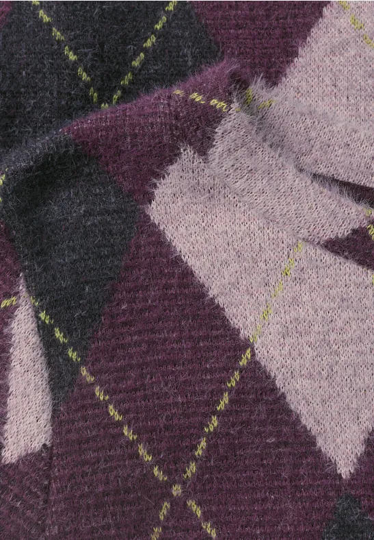 Strickstoff mit Argyle-Muster in Lila, Pink und Schwarz, verziert mit neongrünen Nahtlinien.
