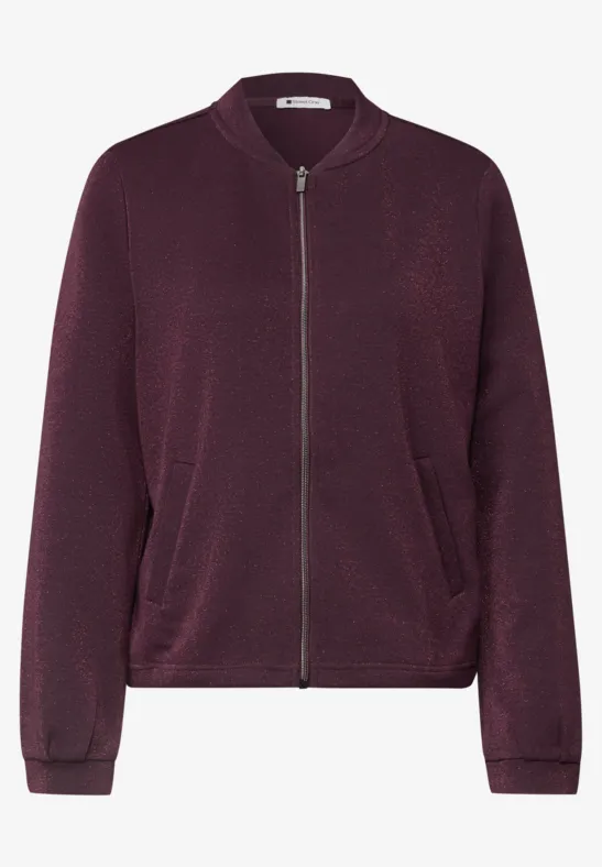 Ein bordeauxfarbener Reißverschluss-Blouson mit seitlichen Taschen.