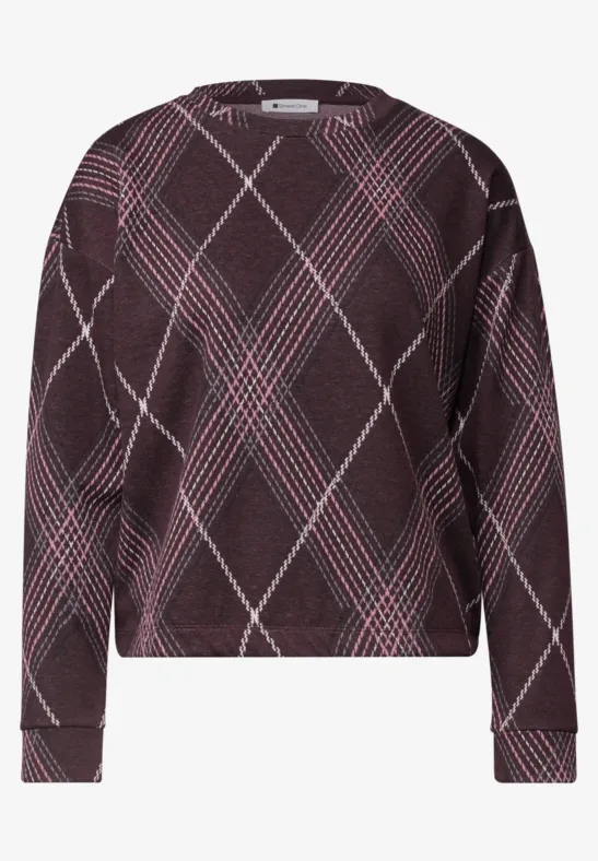 Pull bordeaux à manches longues avec motif écossais rose et blanc, coupe large et droite.