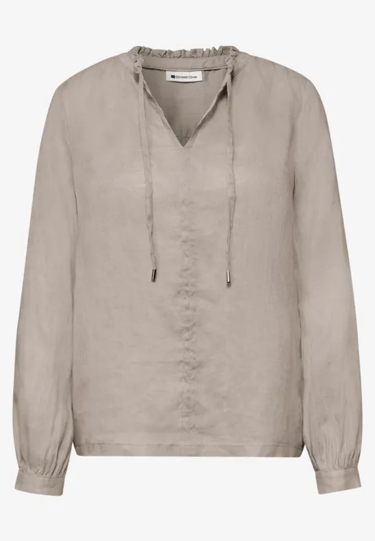 Beige linnen blouse met V-hals, lange mouwen en bindstrikjes.