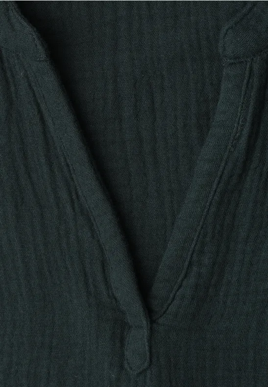 Donkergroen geribd trui met V-hals en knoopsluiting