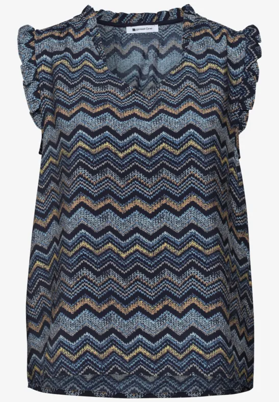 Leichte ärmellose Bluse mit buntem Zickzackmuster und verspieltem Rüschensaum.