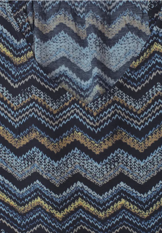 Dunkelblaue, hellblaue und schwarze Zickzack-Muster auf strukturiertem Stoff.