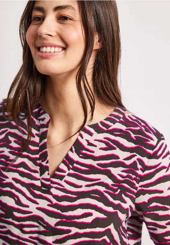 Blouse à manches courtes avec split neck et imprimé minimal rose