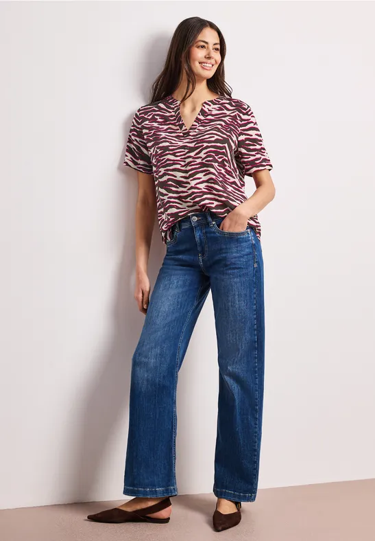 Blouse à manches courtes avec split neck et imprimé minimal rose