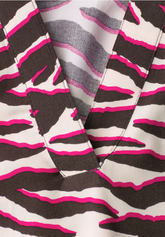 Blouse à manches courtes avec split neck et imprimé minimal rose