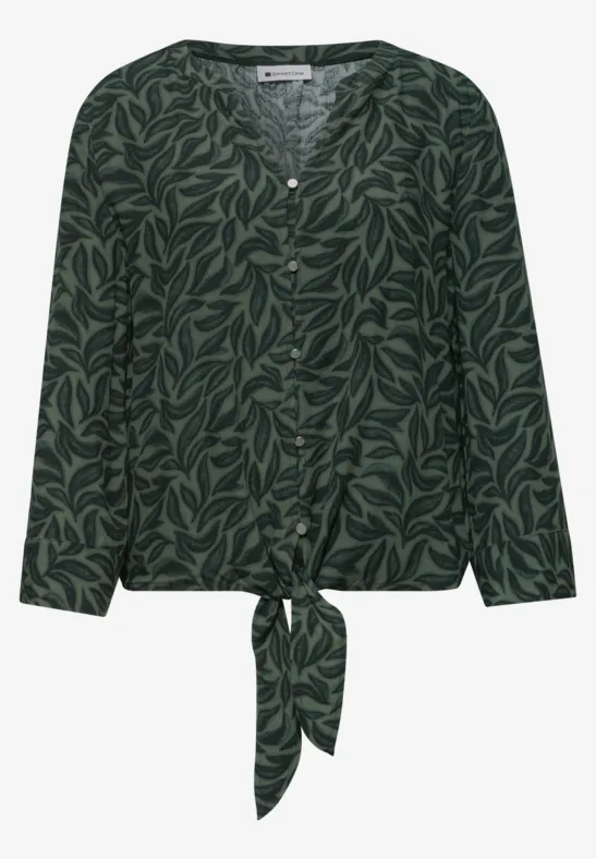 Donkergroen blouse met bladmotief, lange mouwen, knoopsluiting en vooraan een strik.