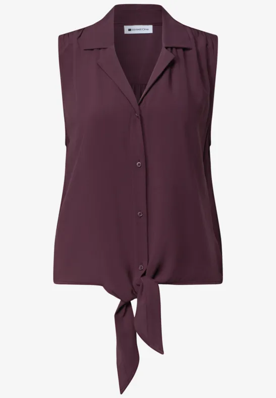 Ärmellose Bluse in Pflaumenfarbe mit Knopfleiste und frontaler Knoten-Optik.