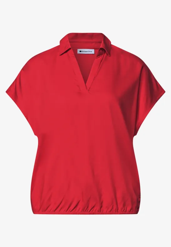 Rotes Damen-Shirt mit V-Ausschnitt, überschnittenen Schulterärmeln und elastischem Saum.