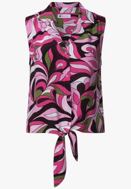 Mouwloze top met knoopdetail en abstract bloemetjespatroon in roze, groen en zwart.