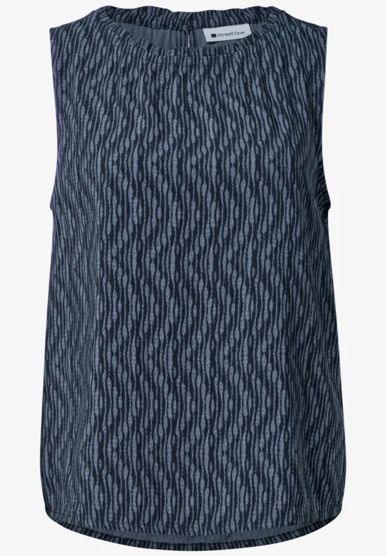 Débardeur sans manches bleu foncé à motif graphique en zigzag et encolure ronde.