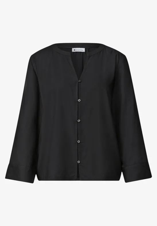 Schwarze Bluse mit langen Ärmeln, V-Ausschnitt und Knopfleiste.