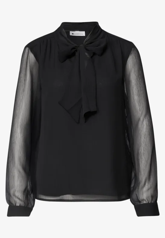 Schwarze Bluse mit transparenten Ärmeln und Schleifenkragen.