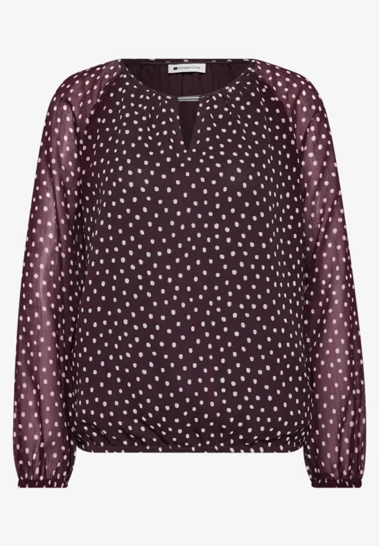 Dunkelrote Bluse mit weißen Tupfen, langen Ärmeln, V-Ausschnitt und elastischem Saum.