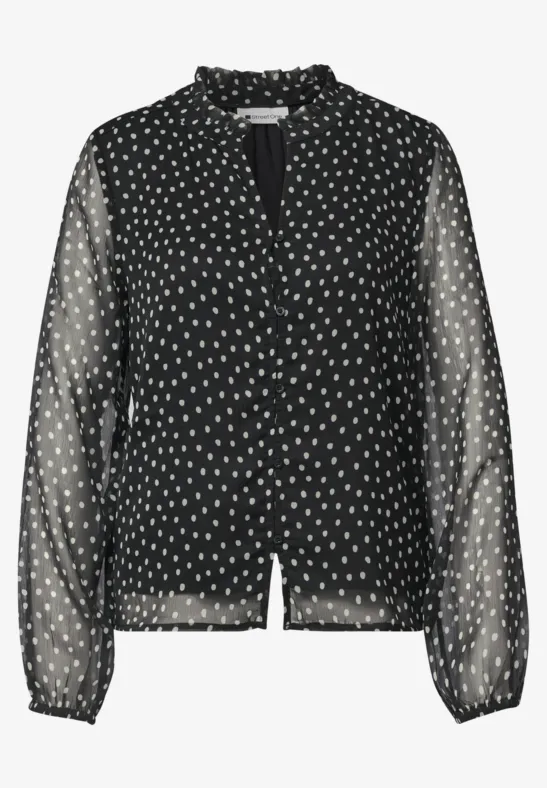 Schwarze, semitransparente Bluse mit weißen Tupfen, Rüschenkragen und langen Ärmeln.