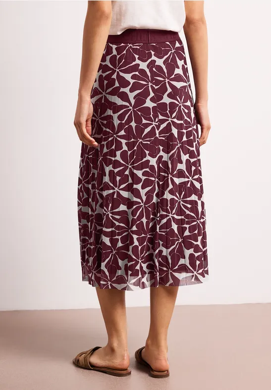 Dames midi-rok bordeauxrood met witte bladerenprint, losvallend, rugaanzicht.