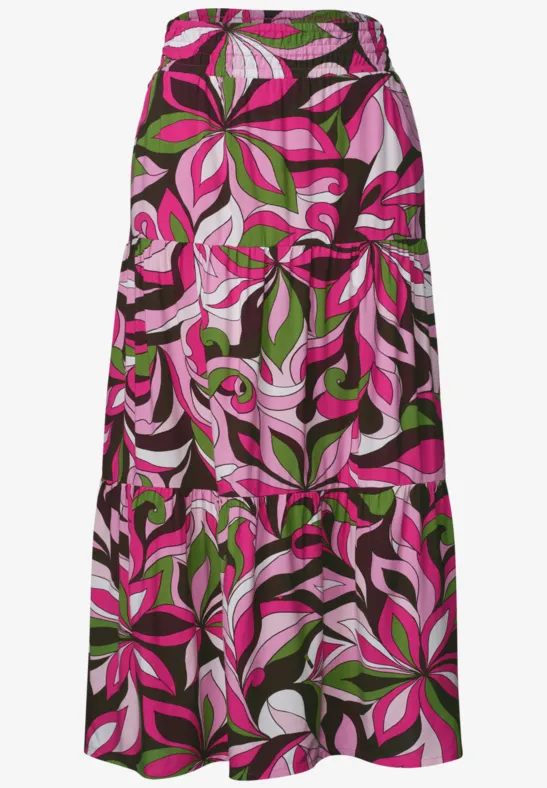 Langer, bunt gemusterter Maxirock mit pink-grünen Blatt-Designs.