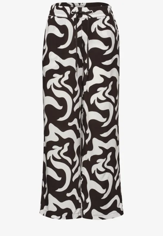 Weite Palazzo-Hose aus leichtem Stoff mit abstraktem Schwarz-Weiß-Muster.
