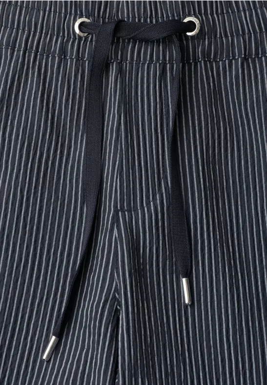 Blauwe gestreepte broek met trekkoord en metalen oogjes