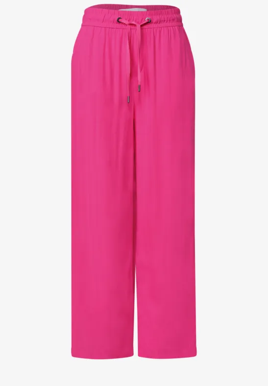 Weit geschnittene pinke Hose mit Tunnelzugbund und lässigem, fließendem Schnitt.