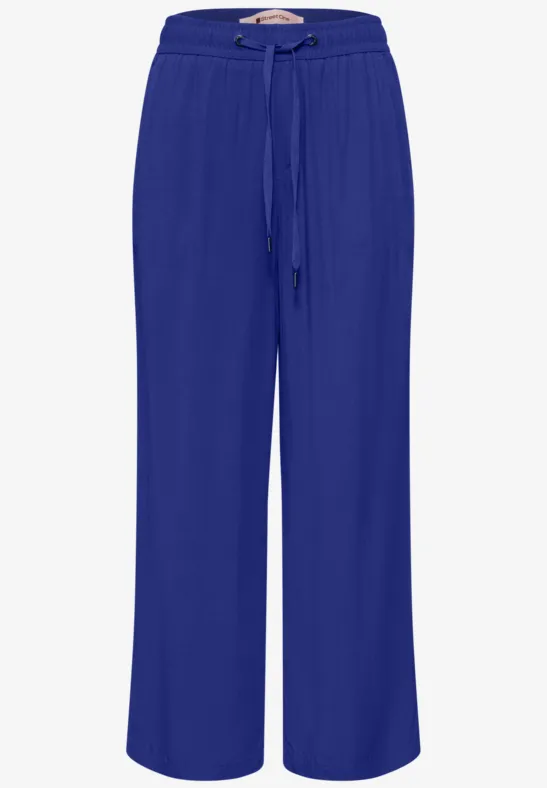 Damesbroek in koningsblauw, wijd model met hoge taille en koordsluiting, ideaal voor een casual look.