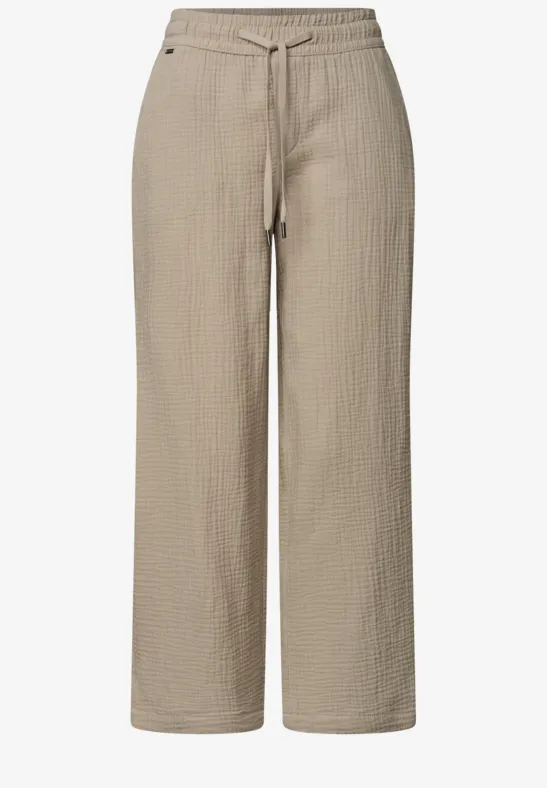 Hellbeige, locker geschnittene Hose aus strukturierter Baumwolle mit elastischem Bund und Kordelzug