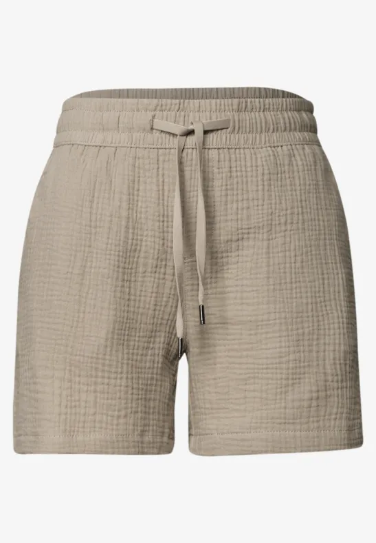 Beige, locker sitzende Shorts aus leichtem, texturiertem Stoff mit elastischem Bund und Kordelzug