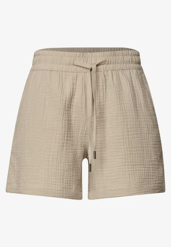 Beige, texturierte Baumwoll-Shorts mit elastischem Bund und Kordelzug.