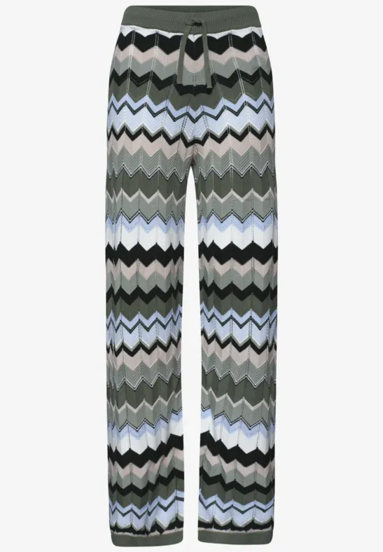 Gebreide broek met meerkleurige zigzagstrepen in groen, grijs, wit, zwart en lichtblauw.