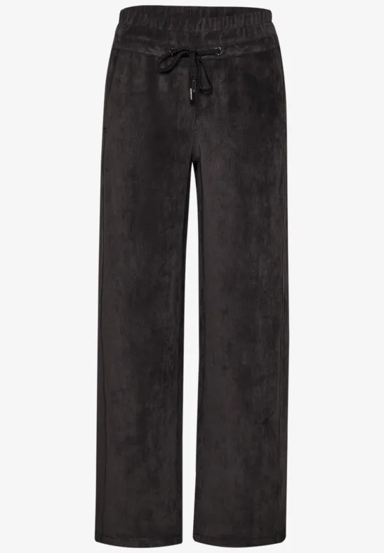 Schwarze, locker geschnittene Cordhose mit elastischem Bund und Kordelzug.