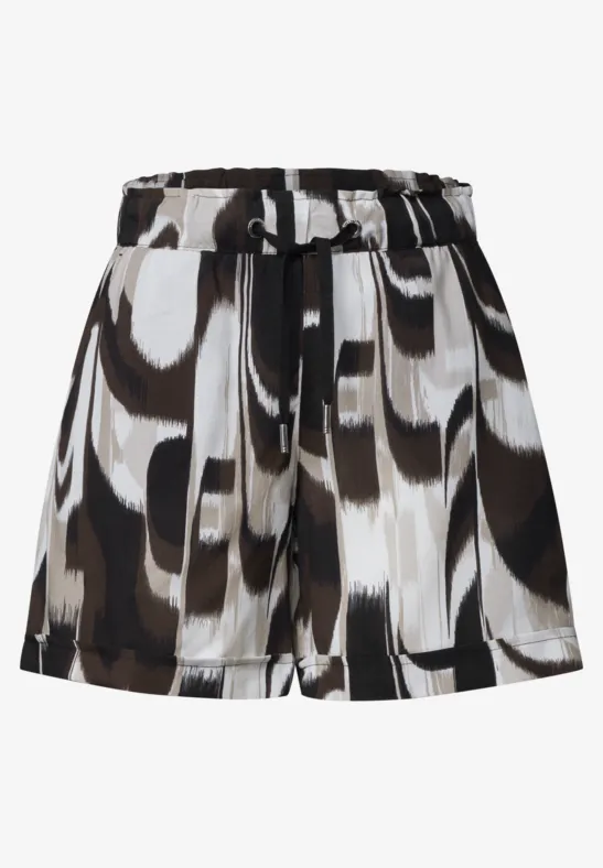 Korte geplooide rok met abstract zwart-wit-bruin dessin en tailleband.