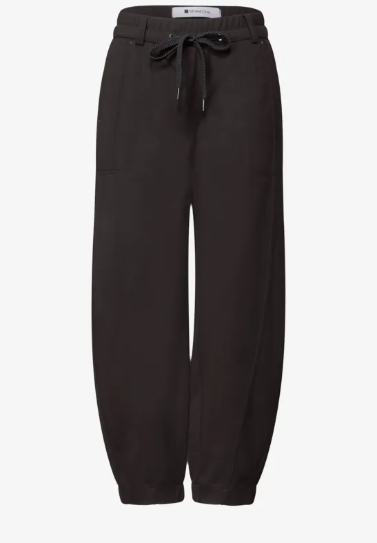 Pantalon de jogging noir à cordon de serrage à la taille et bas élastiques, confortable et décontracté.