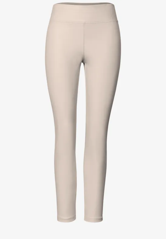 Lichtbeige, nauwsluitende dameslegging met hoge taille