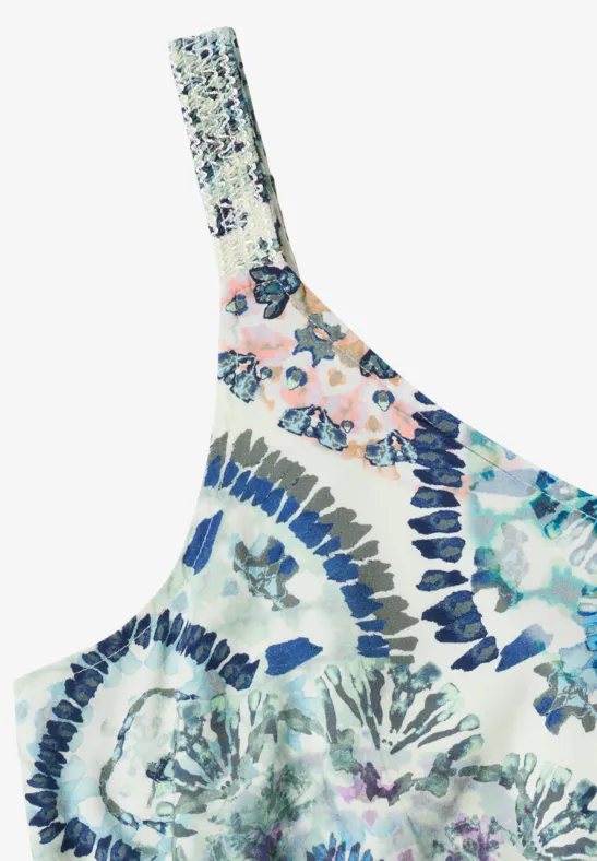 Ein einseitiges Oberteil mit bunter, floraler Musterung in Blau- und Rosatönen.