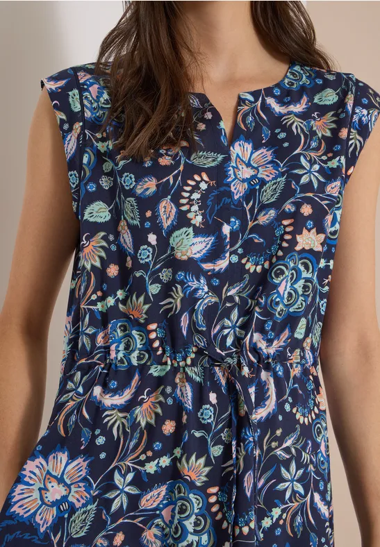Ärmellose dunkelblaue Bluse mit buntem Blumenmuster und Taillenschnürung.