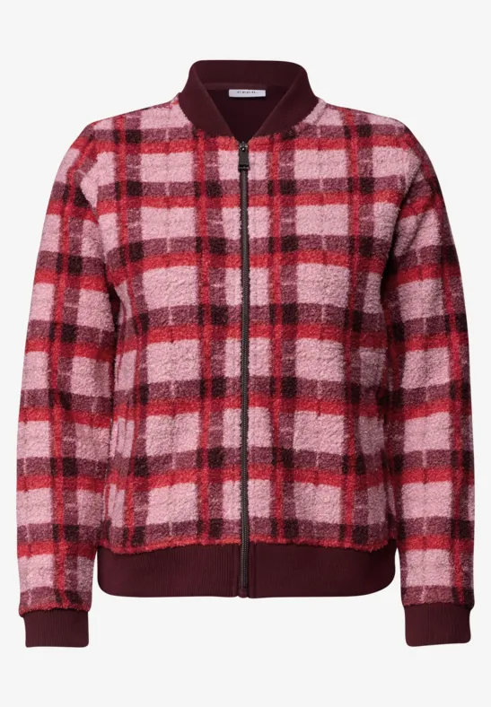 Blouson bomber polaire rouge et rose à carreaux, fermeture éclair et bord-côtes.