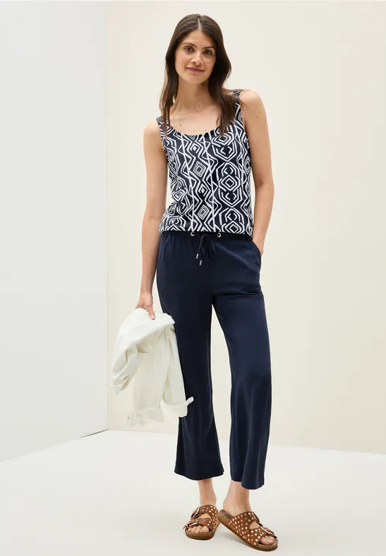 Top avec détails smocks universal blue