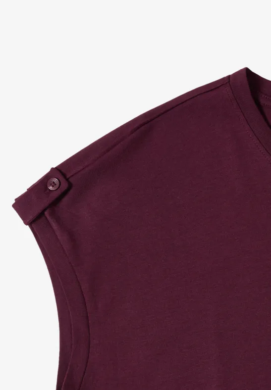 Haut violet à manches courtes avec lanière et bouton à l'épaule