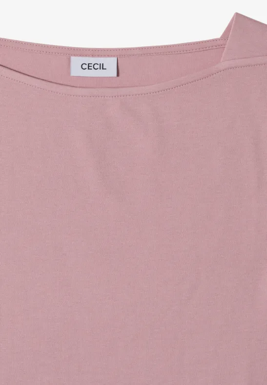Un T-shirt rose uni à col rond avec une étiquette 'CECIL' cousue à l'arrière du col.