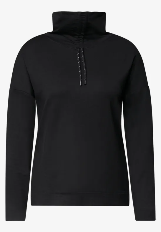 Pull noir pour femme, col montant et demi-zip, style épuré.