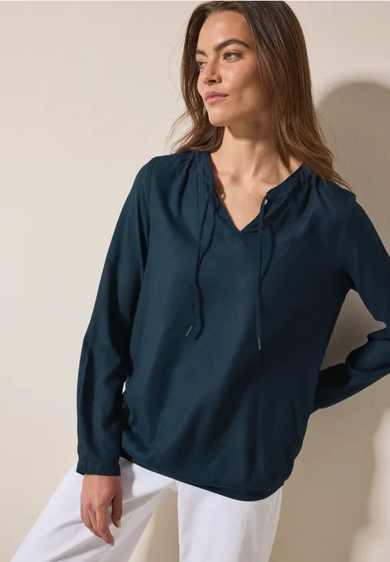 Bluse mit elastischem Saum oil blue
