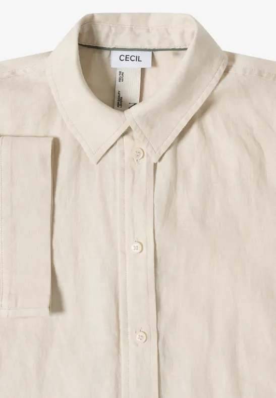 Helles, beige Leinenhemd mit Knopfleiste und klassischem Kentkragen, versehen mit CECIL-Label.