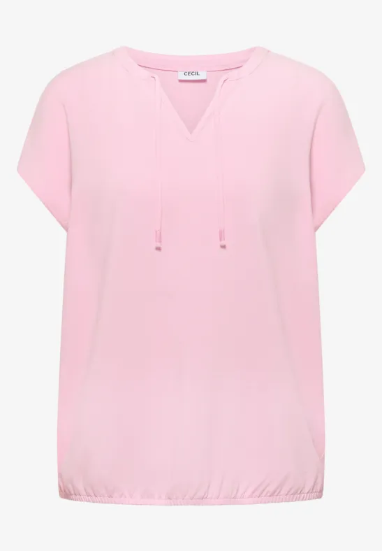 Blouse rose pâle à manches courtes, encolure en V avec cordons et ourlet élastiqué