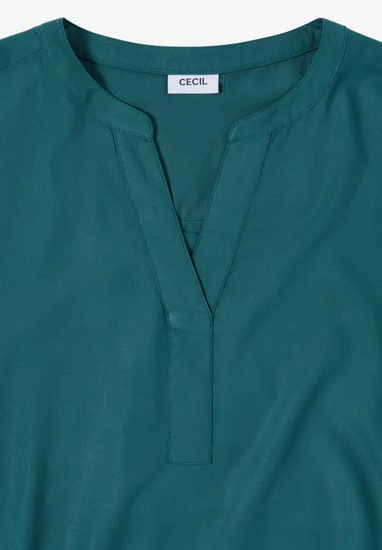 Damenbluse in Petrol mit V-Ausschnitt, langen Ärmeln und Label 'CECIL'.