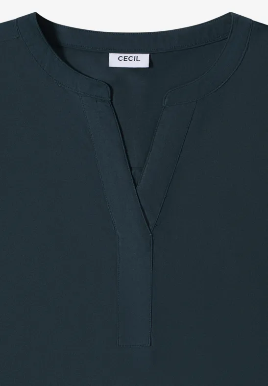 Dunkelblaues, schlichtes Damen-Shirt mit V-Ausschnitt und 'CECIL'-Label im Nacken.