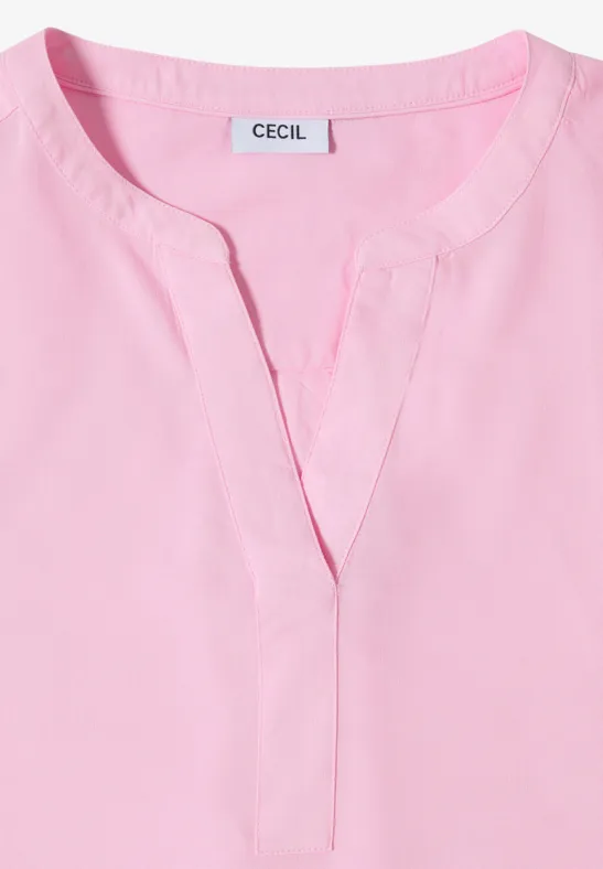Chemisier léger rose à col rond et petite fente en V, étiquette "CECIL".
