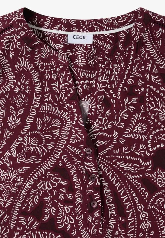 Gefaltetes weinrotes CECIL-Shirt mit weißem Paisley-Muster und V-Ausschnitt.