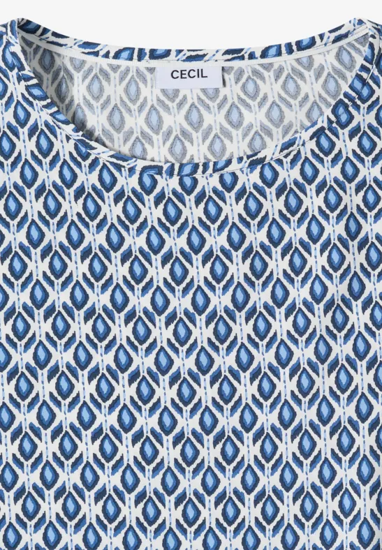 Weiß-blau gemustertes ärmelloses Damenoberteil mit ovalen Mustern und rundem Halsausschnitt.