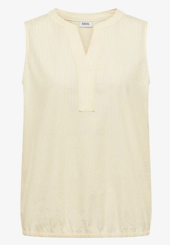 Top sans manches couleur crème, col en V et texture légère.